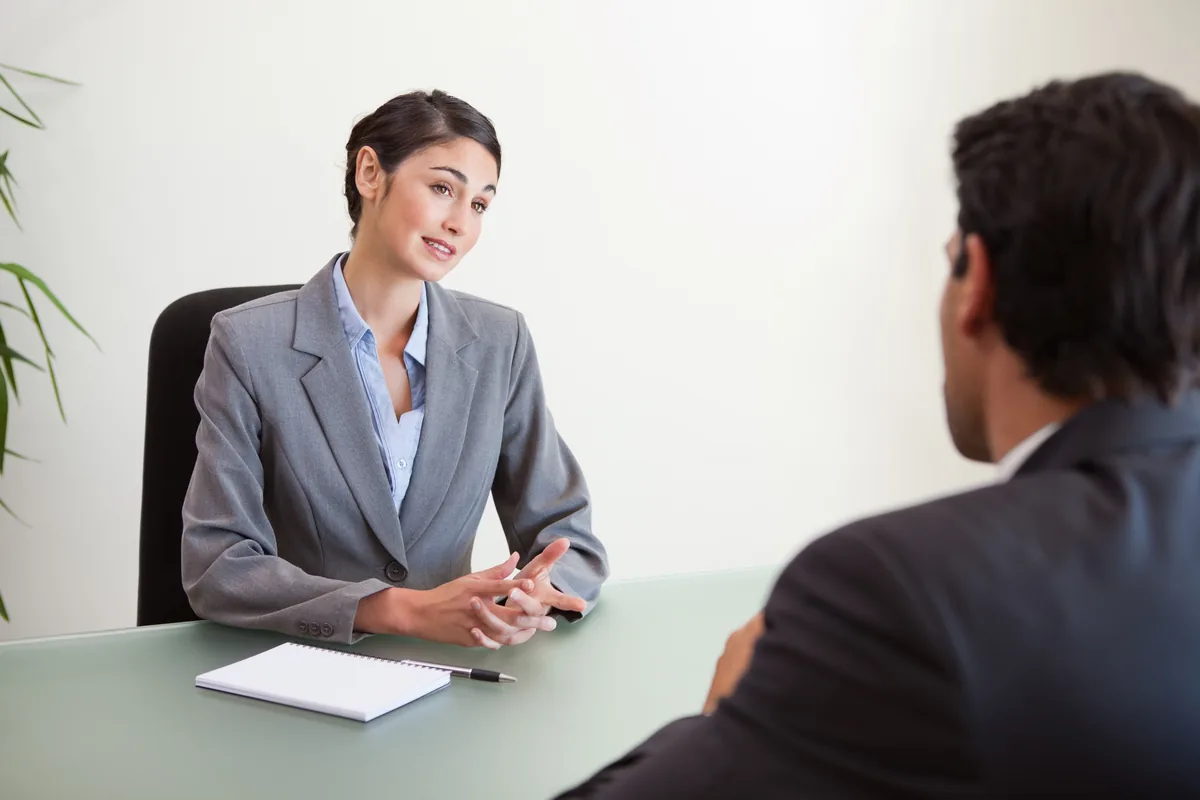 An interview taking place between a candidate and an employer